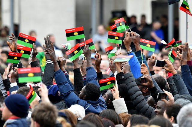 People gathered in St. Peter's square at Vatican, shake Biafra's flag as they listen to Pope Francis' weekly general sunday audience on February 28, 2016. / AFP / VINCENZO PINTO (Photo credit should read VINCENZO PINTO/AFP/Getty Images)